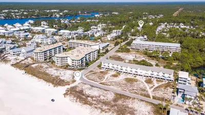 an aerial view of a resort next to the beach at Something Salty in Santa Rosa Beach