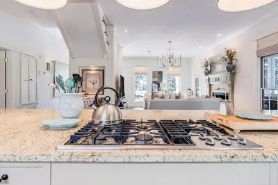 a kitchen with a stove top with a tea kettle on it at Southern Breeze in Inlet Beach