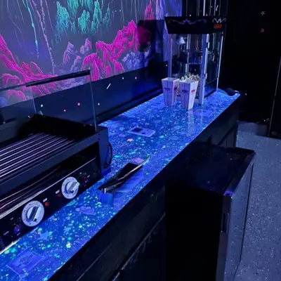 a counter with a fish tank with drinks on it at Sandcastle House Hot Tub, OD Kitchen & Game Room! in Panama City Beach