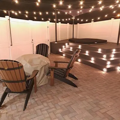 a tent with chairs and a trampoline and lights at Vibrant NewOrleans style retreat in Panama City Beach