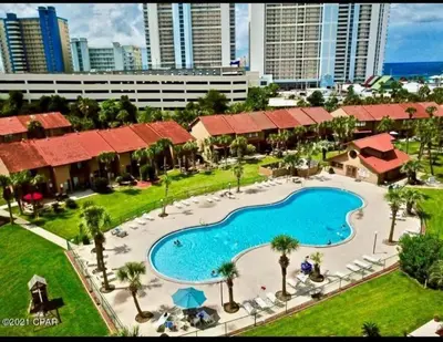 an aerial view of a resort with a large swimming pool at 2 BD 2 and half BA Two Story Beach Haven Pet Friendly with Golf Cart in Panama City Beach