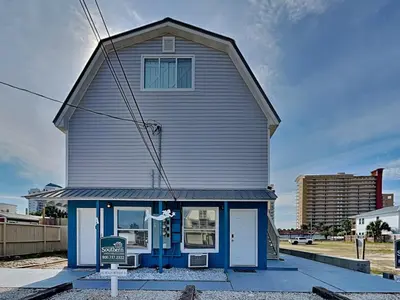 a house with a sign in front of it at PC Beach Retreat D in Panama City Beach