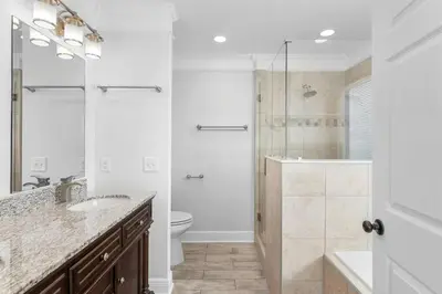 a bathroom with a shower and a sink and a toilet at Beach House - Sunset Escape by Panhandle Getaways in Panama City Beach