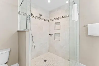 a bathroom with a shower with a glass door at Ramsgate Harbour #16 by 30A Escapes in Panama City Beach