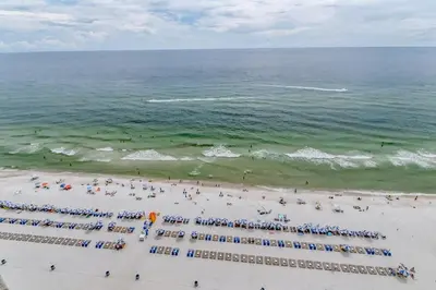 an overhead view of a beach with a crowd of people at Breathtaking gulf-front condo near Pier Park in Panama City Beach