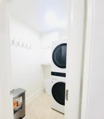 a television sitting on a stand in a room at Stunning 4BD Jacuzzi - 4 Min To Beach Panama City in Panama City Beach