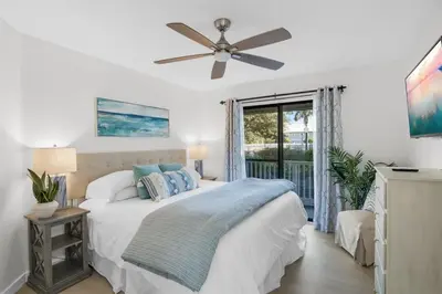 a bedroom with a bed and a ceiling fan at After Dune Delight Pool Tennis Walk To Beach in Seagrove Beach