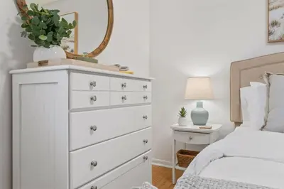 a bedroom with a white dresser with a mirror at Sea Esta 30A Beautiful Condo Close To Beach in Seagrove Beach