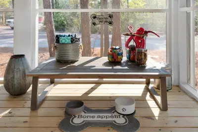 a wooden table in a room with a window at Goin' Coastal Pet Friendly 6-Seater Golf Cart in Seacrest
