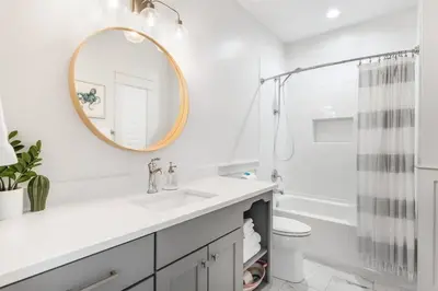 a white bathroom with a sink and a mirror at Southern Tides 4BR 4 5BA Sleeps 14 Golf Cart in Seacrest