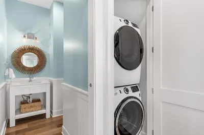 a laundry room with a washer and dryer at The Crab House Golf Cart Bikes in Seacrest