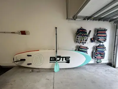 a surfboard is sitting in a room with a wall at Sea Change At Eastern Lake Private Pool in Watersound Beach