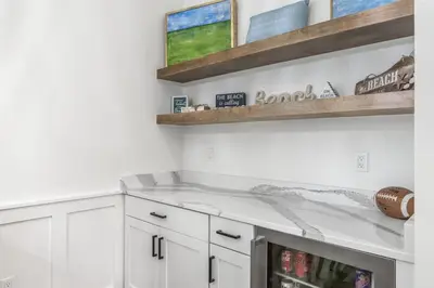 a kitchen with white cabinets and a counter top at Shore Me The Way Close To Beach Bikes in Seacrest