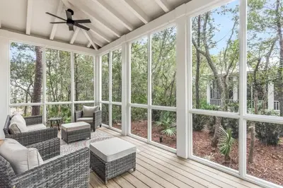 a screened porch with furniture and large windows at Shore Me The Way Close To Beach Bikes in Seacrest