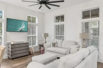 a living room with a couch and a ceiling fan at Shore Me The Way Close To Beach Bikes in Seacrest