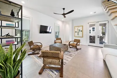 a living room with a couch and a tv at Big Beach Watch near beach private pool sleeps 21 in Santa Rosa Beach