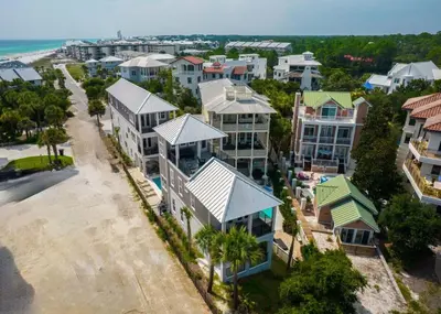 an aerial view of a city with houses at Big Beach Watch near beach private pool sleeps 21 in Santa Rosa Beach