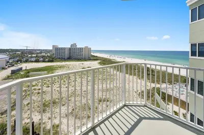 a balcony with a view of the beach at Boardwalk 501 in Panama City Beach