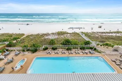 an overhead view of a swimming pool and the beach at Twin Palms 603 in Panama City Beach