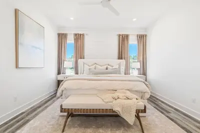 a white bedroom with a large bed and windows at New Pool 5 Bedroom Screened Porch in Inlet Beach