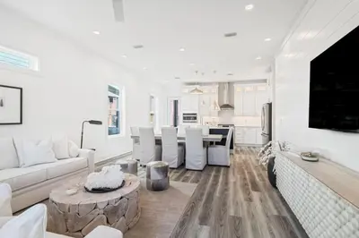 a white living room with a couch and a table at New Pool 5 Bedroom Screened Porch in Inlet Beach