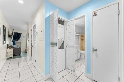 a bathroom with a walk in shower and a toilet at Endless Summer #D1 in Panama City Beach