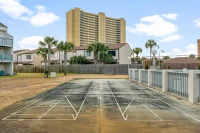 an empty parking lot in front of a building at Endless Summer #D1 in Panama City Beach