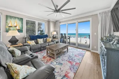 a living room with a couch and a table at Grandview East 101 in Panama City Beach