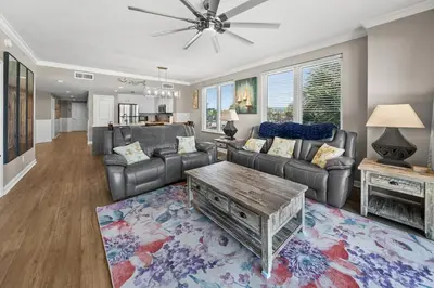 a living room with a couch and a table at Grandview East 101 in Panama City Beach