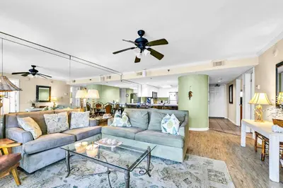 a living room with a couch and a table at One Seagrove Place 702 Gulf-front unit sleeps 6 in Santa Rosa Beach
