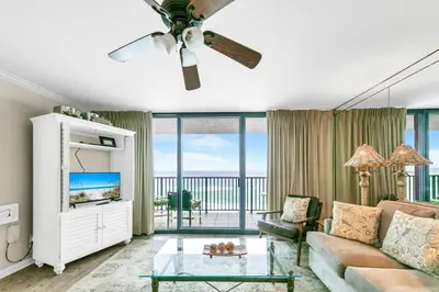 a living room with a couch and a ceiling fan at One Seagrove Place 702 Gulf-front unit sleeps 6 in Santa Rosa Beach