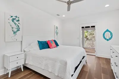 a white bedroom with a bed and a window at Caspian Blue Paradise 30A Luxe Retreat in Seacrest