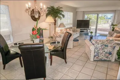 a living room with a table and chairs at Destin Towers 1E in Panama City