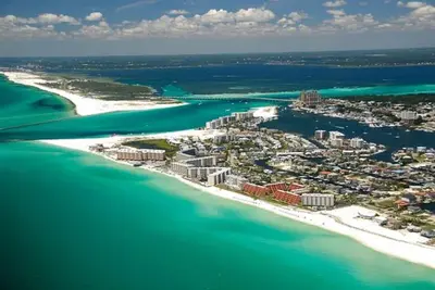 an aerial view of a tropical island in the ocean at Destin Towers 1E in Panama City