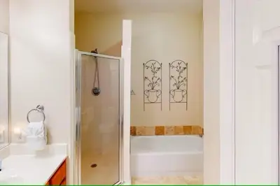 a bathroom with a shower and a bath tub at Seagrove Highlands 1304 in Santa Rosa Beach