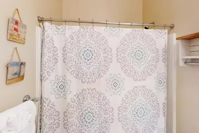 a shower curtain in a bathroom with a white at Seagrove Highlands 1304 in Santa Rosa Beach