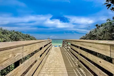 a wooden boardwalk leading to the beach at Seagrove Highlands 1304 in Santa Rosa Beach