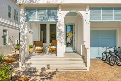 a front porch of a home with two bikes on it at Sand On Tap in Inlet Beach