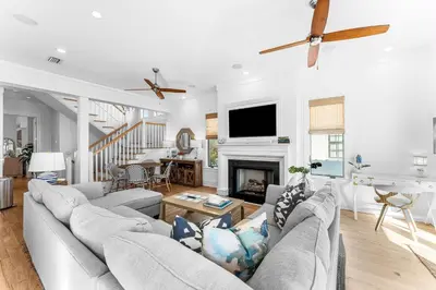 a living room with a couch and a fireplace at Sand On Tap in Inlet Beach