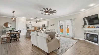 a living room with a couch and a fireplace at Guilty Treasure in Panama City Beach