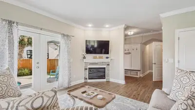 a living room with a couch and a fireplace at Guilty Treasure in Panama City Beach