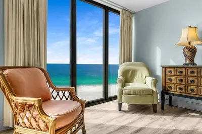 a living room with a view of the ocean at 2BD Edgewater Beach & Golf Resort! Best Amenities! by Dolce Vita Getaways PCB in Panama City Beach