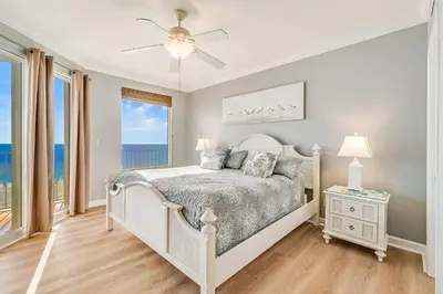a bedroom with a bed with a view of the ocean at Beachfront 3BR Condo! Free Beach Chair Service! by Dolce Vita Getaways PCB! in Panama City Beach