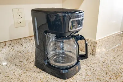 a black blender sitting on top of a counter at Beachfront 3BR Condo! Free Beach Chair Service! by Dolce Vita Getaways PCB! in Panama City Beach