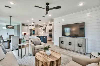 a living room with a flat screen tv on a wall at R3 at Lake Powell near Panama City Beach and 30A in Panama City Beach