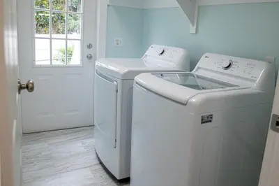 a white laundry room with a washer and dryer at R3 Orange at Inlet Beach with Pool, EV Connector and RV Parking in Inlet Beach