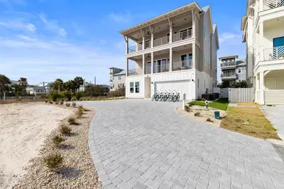 a large white building with a driveway at The Luxe Lookout in Inlet Beach