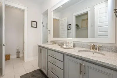 a bathroom with a sink and a mirror at Sea - Esta Prominence 30A! BESIDE POOL! 6 seater LSV! 4 Bikes Sleeps 6! in Watersound Beach