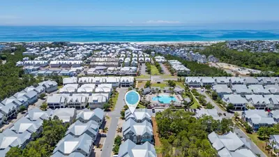 an aerial view of a resort at Sea - Esta Prominence 30A! BESIDE POOL! 6 seater LSV! 4 Bikes Sleeps 6! in Watersound Beach