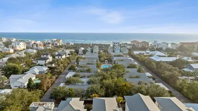 arial view of a residential neighborhood with houses and the ocean at Peacock Cottage in Inlet Beach
